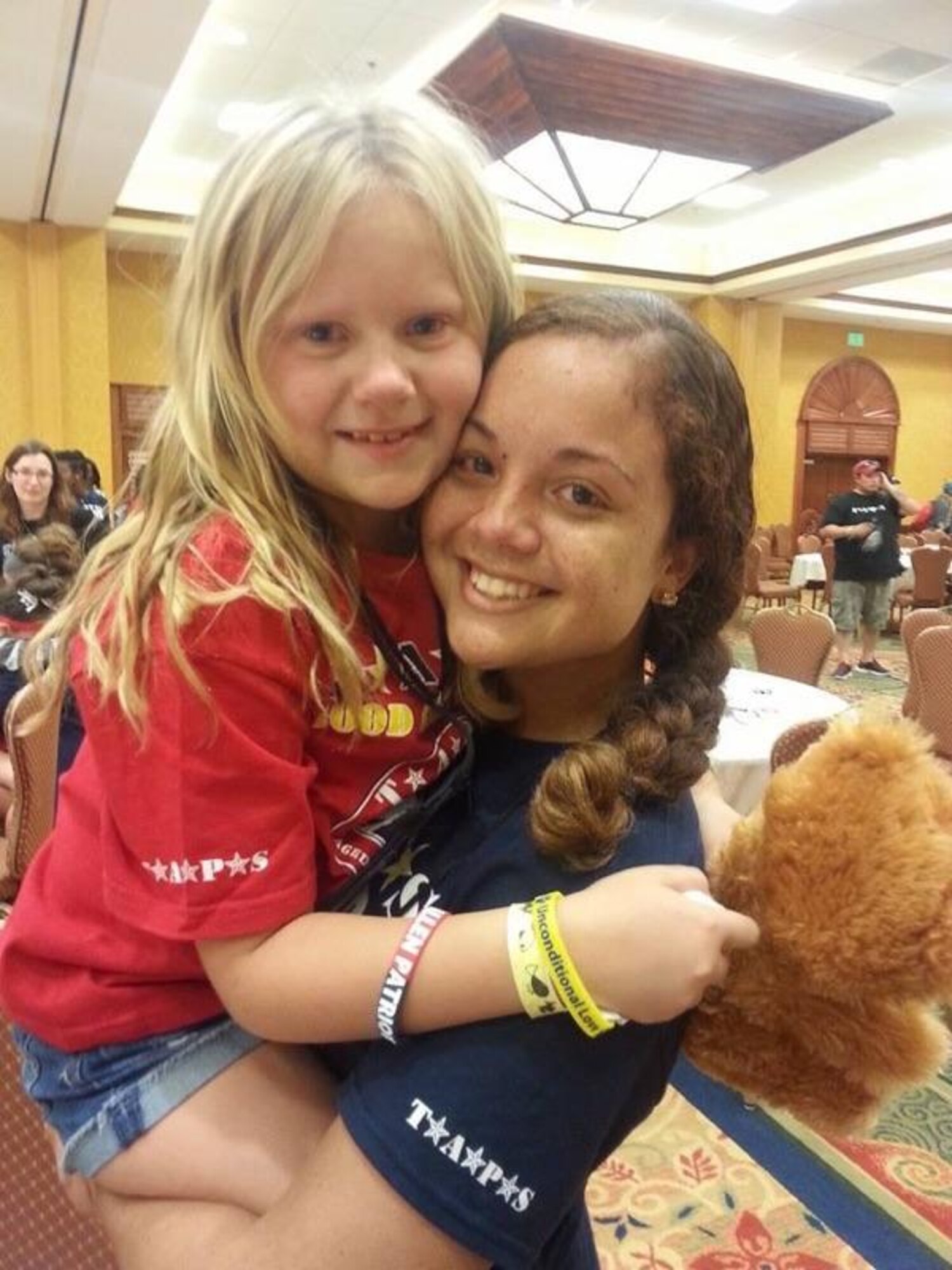 Staff Sgt. Naara Miguez Vera, and her survivor Lauren, share a hug during a Tragedy Assistance Program for Survivors retreat. Miguez, the medical readiness noncommissioned officer in charge at the 927th Aerospace Medicine Squadron, MacDill Air Force Base Fla., is a TAPS mentor, and travels throughout the country aiding in the healing process of families of fallen U.S. Military members. (Courtesy photo)
