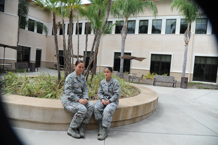 Staff Sgt. Naara Miguez Vera (left) and Senior Airman Lorimar Rivera, 927th Aerospace Medicine Squadron, MacDill Air Force Base Fla., plan to travel to Crystal City, Virginia, during the Memorial Day weekend to participate in the Tragedy Assistance Program for Survivors. TAPS, a not-for- profit organization that offers compassionate care to families grieving from the loss of loved ones serving in the U.S. Military. (U.S. Air force photo/ Senior Airman Xavier Lockley)
