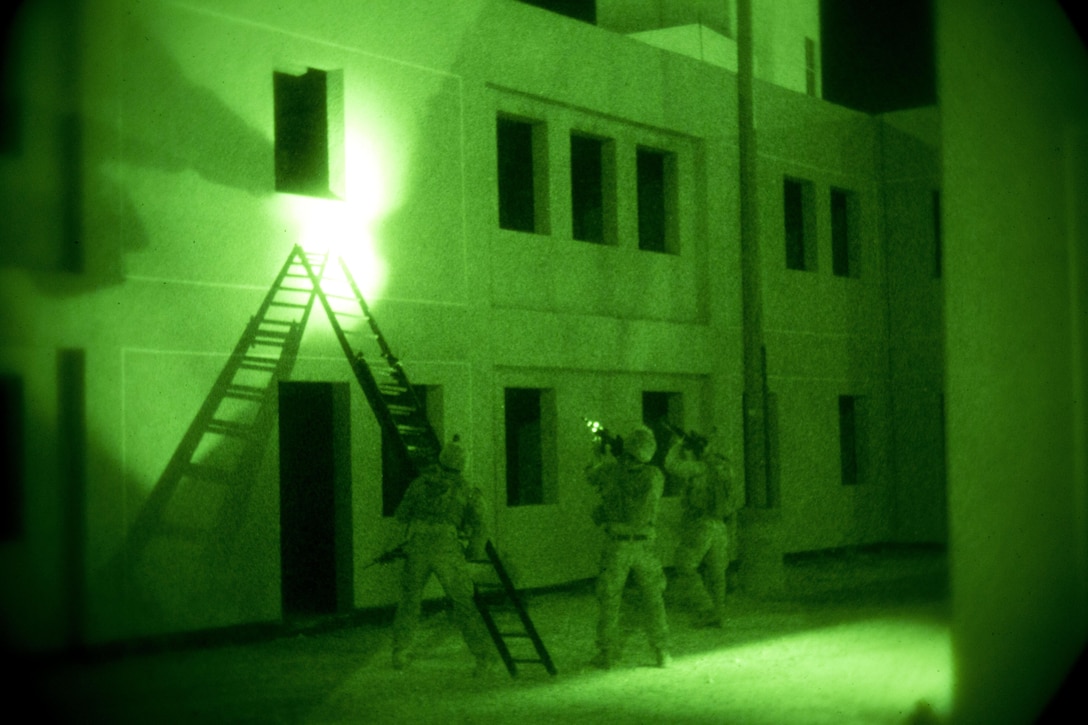 U.S. Marines with India Company, 3rd Battalion, 7th Marine Regiment, Special Purpose Marine Air-Ground Task Force-Crisis Response, Central Command, search a building for threats during a non-combatant evacuation operation as part of Exercise Eager Lion at the King Abdullah Special Operations Training Center in Amman, Jordan, May 15, 2015. Eager Lion is a recurring, multinational exercise designed to strengthen military-to-military relationships, increase interoperability between partner nations, and enhance regional security and stability.