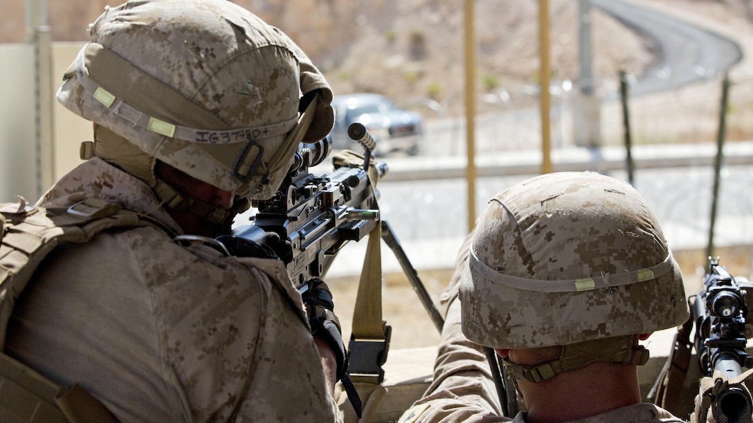 U.S. Marines with India Company, 3rd Battalion, 7th Marine Regiment, Special Purpose Marine Air-Ground Task Force-Crisis Response, Central Command, scan for threats during a non-combatant evacuation operation as part of Exercise Eager Lion at the King Abdullah Special Operations Training Center in Amman, Jordan, May 15, 2015. Eager Lion is a recurring, multinational exercise designed to strengthen military-to-military relationships, increase interoperability between partner nations, and enhance regional security and stability.