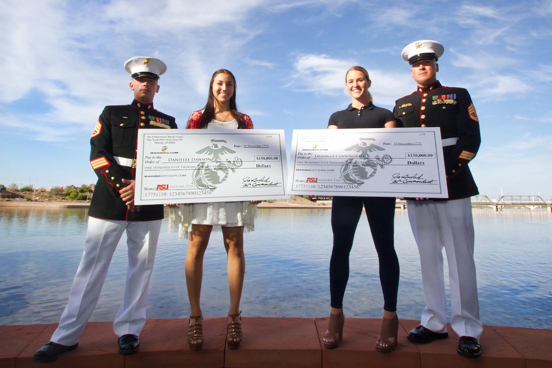 Arizona Marines recognize Danielle Dawson, center left, a senior at Desert Vista High School in Phoenix, and Savannah Cunningham, a senior at Horizon Honors High School in Phoenix, for each accepting the selective Marine Corps Naval Reserve Officers Training Corps [NROTC] Scholarship during a presentation at the Tempe Center For the Arts in Tempe, Ariz. May 11, 2015. Dawson and Cunningham each won the scholarship based on their commitments to the classroom, their community, and physical fitness. “I was actually getting ready for a ballet performance when I got the phone call about receiving this scholarship,” said Dawson. “It was exhilarating, I was speechless – nobody would think of a ballerina being on her way to becoming a Marine Corps officer.” Cunningham, on receiving the scholarship said, “I’m not doing it just to be in the military, I’m doing it because I want to earn the title Marine.” Cunningham, a multi-sport athlete, added, “I’ve been in leadership positions throughout my life, now I want the opportunity to learn to do it in the best branch of military in the world.” Dawson and Cunningham will both be studying at Arizona State University. For more information about the Marine Corps NROTC scholarship program, visit <a href="http://www.marines.com/becoming-a-marine/commissioning-programs/four-year-colleges/nrotc">http://bit.ly/MarineCorpsOfficer</a>. (U.S. Marine Corps photo by Sgt. Tyler J. Bolken)
