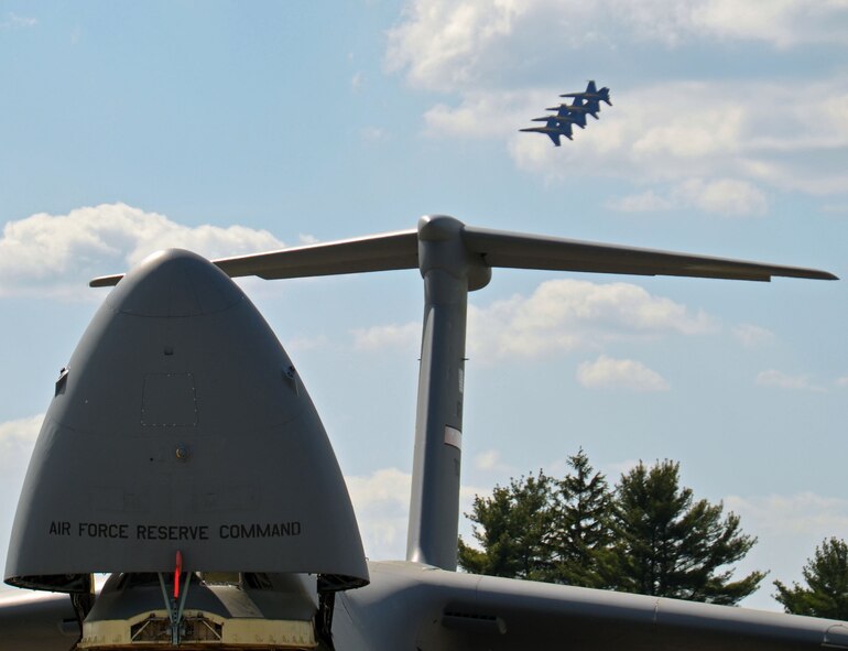 A tight U.S. Navy Blue Angels formation flies over the tail of a U.S. Air Force C-5 at the Great New England Air Show on May 17. The air show, which brought in about 400,000 viewers, kicked-off on Armed Forces Day.