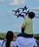 A young spectator flies his toy model F/A-18 Hornet along with the U.S. Navy Blue Angels F/A-18 Hornet formation at The Great New England Air Show May 17. The air show kicked-off on Armed Forces Day, and showcased each branch through performances by the U.S. Navy Blue Angels, the U.S. Air Force F-22 Raptor demo team, and the U.S. Army Golden Knights. (U.S. Air Force photo by SrA. Monica Ricci)