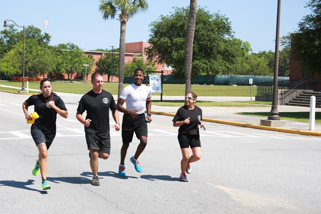 Team WFT - Black Shirts participates in the Centennial 100k Relay Race aboard Marine Corps Recruit Depot Parris Island, S.C., May 16, 2015. The WFT - Black Shirts finished the race in nine hours and two minutes. (Photo by Lance Cpl. Allison Lotz)