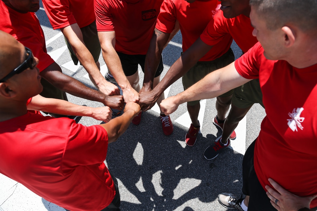 Marines with 1st Recruit Training Battalion celebrate after completing the Centennial 100k Relay Race aboard Marine Corps Recruit Depot Parris Island, S.C., May 16, 2015. The 1st Recruit Training Bn. team finished third with a time of seven hours and 44 minutes. (Photo by Lance Cpl. Allison Lotz)