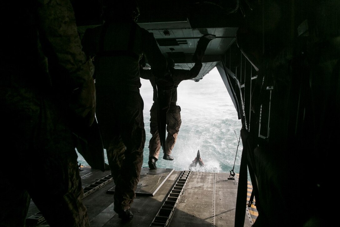 U.S. Marines with the 15th Marine Expeditionary Unit’s Maritime Raid Force helocast out of a CH-53 Super Stallion aboard Marine Corps Base Hawaii, May 14, 2015. The MRF is taking advantage of training opportunities in Hawaii as they transit the Pacific during deployment with the 15th MEU. (U.S. Marine Corps photo by Cpl. Anna Albrecht/Released)