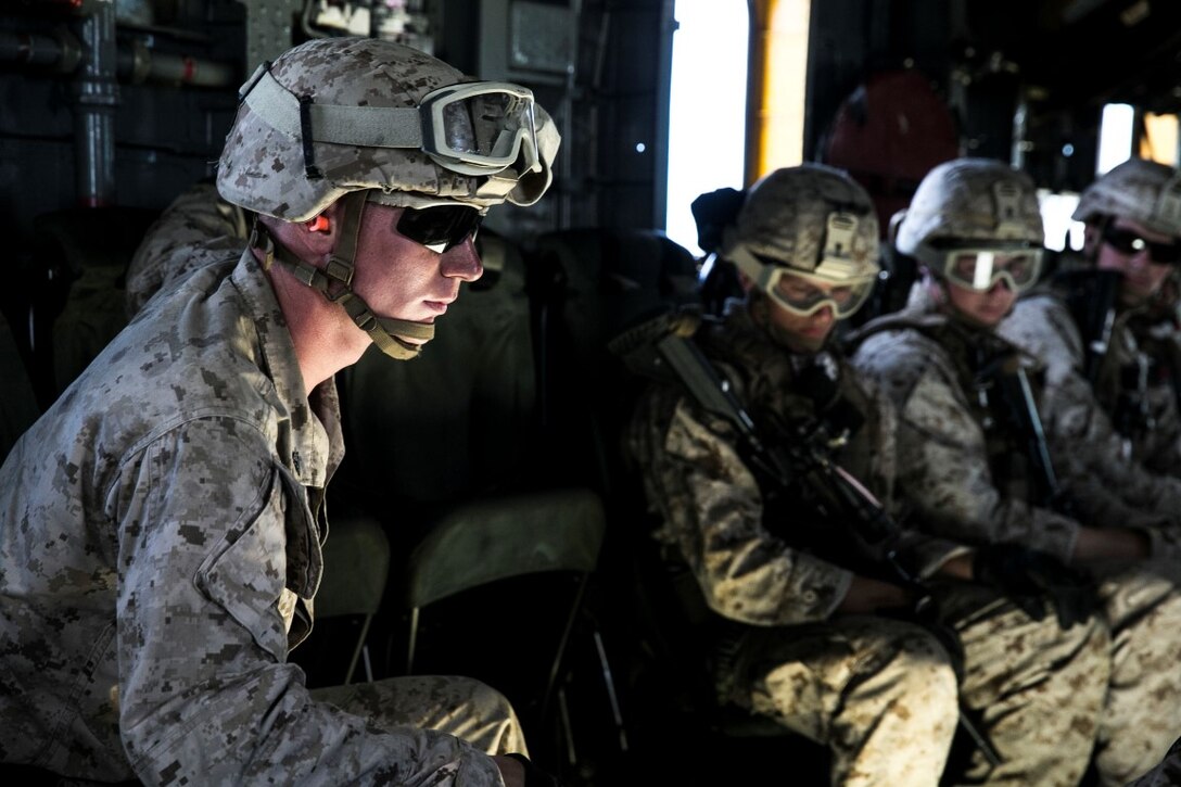 U.S. Marine Cpl. Collin Bauman prepares to fast rope with his squad out of a CH-53E Super Stallion aboard Marine Corps Base Hawaii, May 12, 2015. Bauman is a with the 15th Marine Expeditionary Unit’s Maritime Raid Force security element. These Marines practice fast roping to ensure they are prepared for any type of mission. (U.S. Marine Corps photo by Cpl. Anna Albrecht/Released)