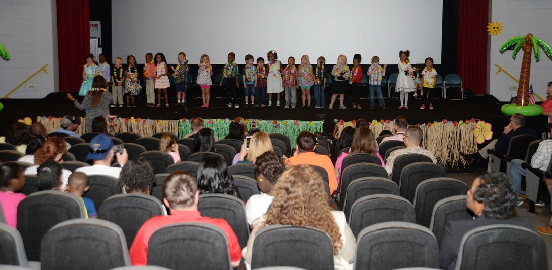 Pre-K students at Marine Corps Logistics Base Albany’s Child Development Center entertain parents, installation staff and other guests with a number of vocal selections during an End of Year Program at the Base Theater, May 19. The graduating students received certificates as part of their rite of passage from the CDC’s Pre-K Program into kindergarten.