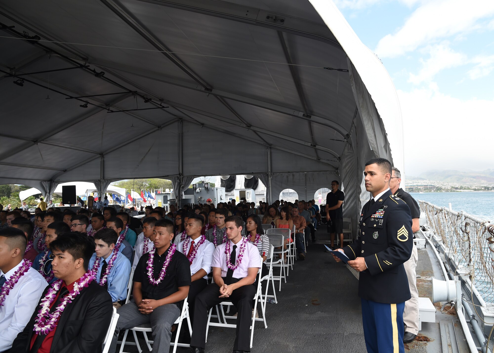 Army Staff Sgt. Justin Godinet, Army Recruiting Company recruiter, ensures his enlistees are prepared for the Our Community Salutes Recognition Ceremony at the USS Battleship Missouri Memorial on Ford Island, Hawaii, May 17, 2015. Our Community Salutes is a community-based initiative to recognize and honor graduating high school seniors who plan to join the Armed Forces after graduation. The OCS ceremony started in southern New Jersey in 2009 and has now spread across the nation.  (U.S. Air Force photo by Tech. Sgt. Aaron Oelrich/Released) 