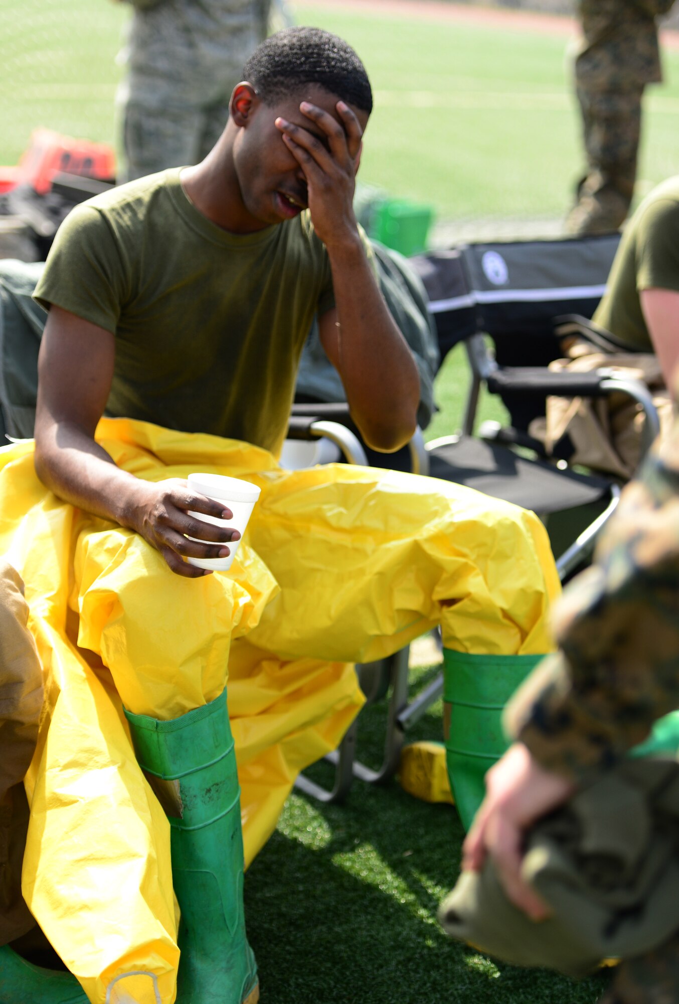 Marine Cpl. Craig Antwine, 1st Marine Aircraft Wing Emergency Manger, takes a moment to recuperate after completing the second Annual Marine Responders Fitness Test, March 20, 2015 at Osan Air Base, Republic of Korea.  Marines from the 1st MAW out of Camp Foster, Japan were in Osan participating in a Joint CBRNE training series of exercises with Emergency Managers from the 51st Civil Engineer Squadron.  
(USAF photo by Staff Sgt. Amber Grimm)