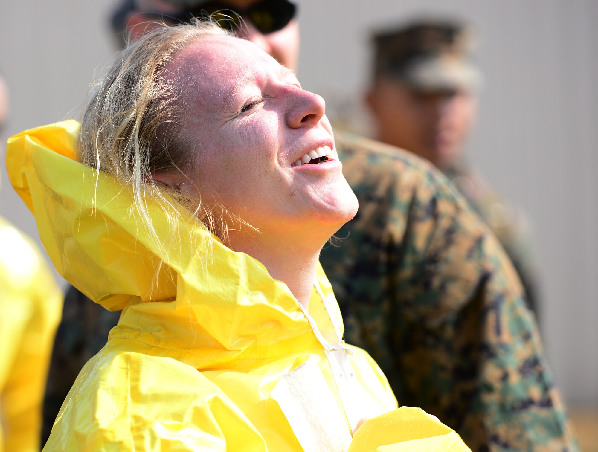 Staff Sgt. Eva Gaus, a member of the 51st Civil Engineers Emergency Managers Team, ecstatically breathes in fresh air after completing her run through of the second Annual Marine Responders Fitness Test, March 20, 2015 at Osan Air Base, Republic of Korea.  The four participating teams suited up in two types of full class B CBRNE protection suits to perform a series of tasks, gaining points for speed and oxygen conservation.
(USAF photo by Staff Sgt. Amber Grimm)