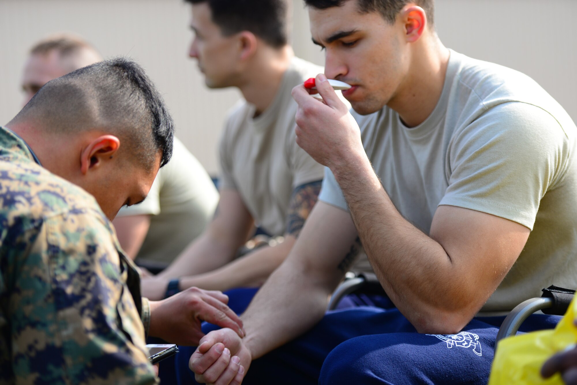 Senior Airman Matthew Whelan a firefighter with the 51st Civil Engineer Squadron gets his vitals checked prior to competing in the second Annual Marine Responders Fitness Test, March 20, 2015 at Osan Air Base, Republic of Korea. The four participating teams suited up in two types of full class B CBRNE protection suits to perform a series of tasks, gaining points for speed and oxygen conservation.
(USAF photo by Staff Sgt. Amber Grimm)