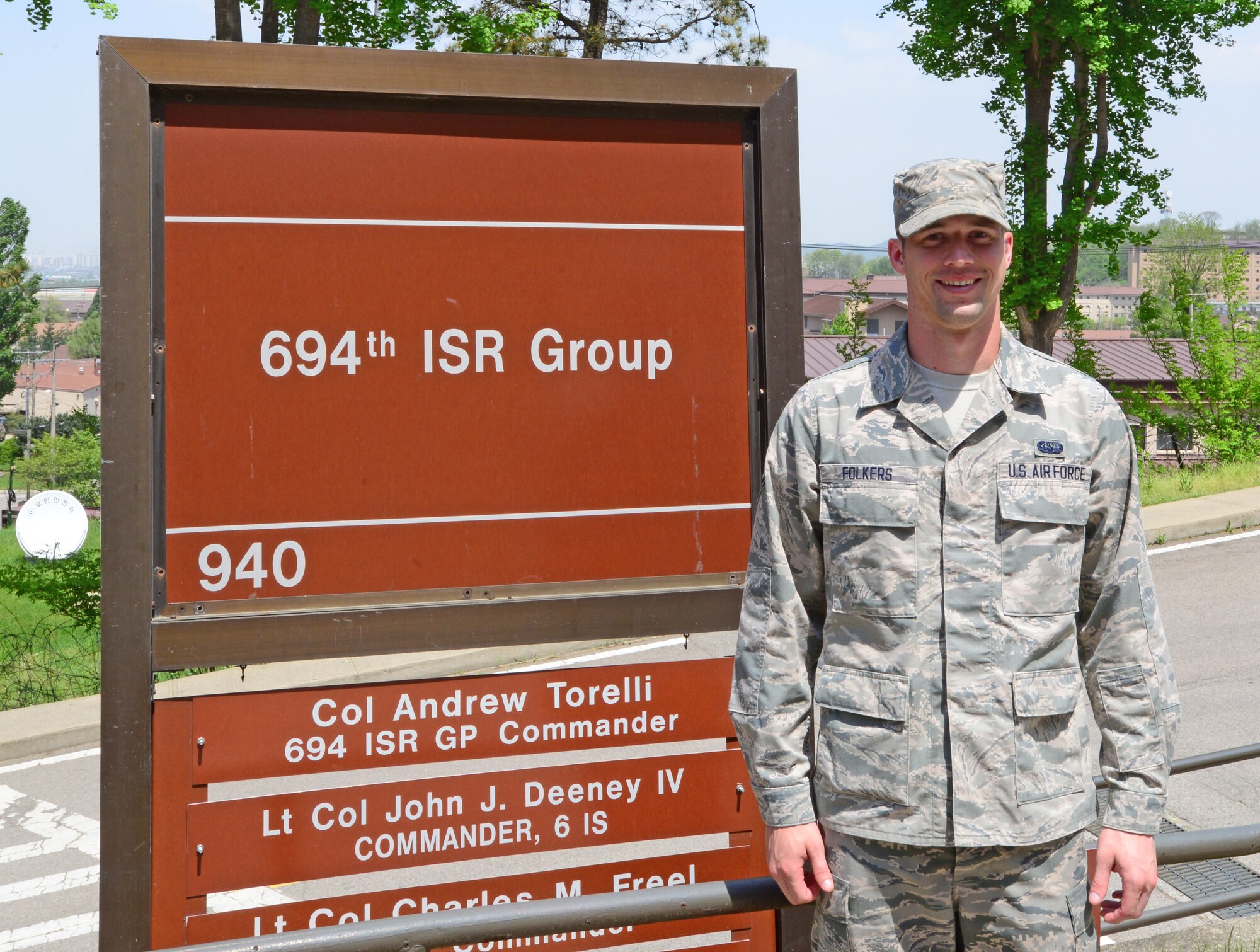 Airman 1st Class Mark Folkers, 694th Intelligence Support Squadron client systems technician, poses for a photo May 4, 2015, at Osan Air Base Republic of Korea. Folkers was chosen as a Team Osan Spotlight award winner. Individuals who are chosen for this spotlight recognition are distinguished as consistent, superior performers within their squadrons. (U.S. Air Force photo by Staff Sgt. Benjamin Sutton/Released)