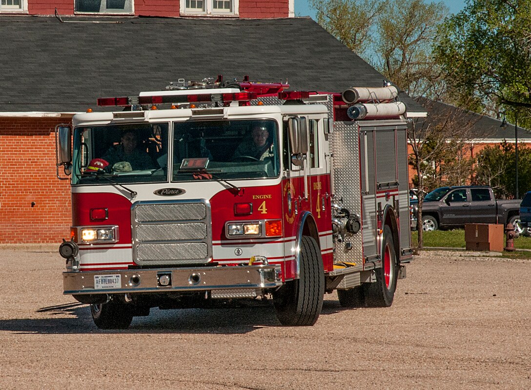 Airman 1st Class Augustus Whitt, 90th Civil Engineer Squadron firefighter, drives a P22 fire truck May 16, 2015, on F.E. Warren Air Force Base, Wyo., during training to become certified in its operation while Staff Sgt. Roberto Rivera, 90th CES firefighter, rides along to provide direction and guidance. The driving course is taken in conjunction with computer-based training. (U.S. Air Force photo by Senior Airman Jason Wiese)