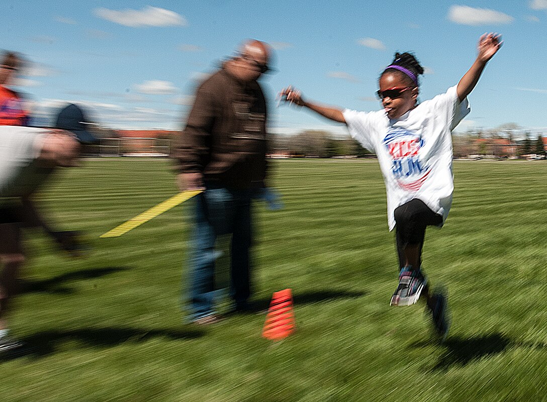 Joy Brisby, 6, leaps for distance during the long jump competition on the Argonne Parade Field on F.E. Warren Air Force Base, Wyo., May 16, 2015. Track and Field events including the long jump, 500- and 700-meter runs and a sack race took place on the field after the America’s Kids Run race taking place the same day. (U.S. Air Force photo by Senior Airman Jason Wiese)