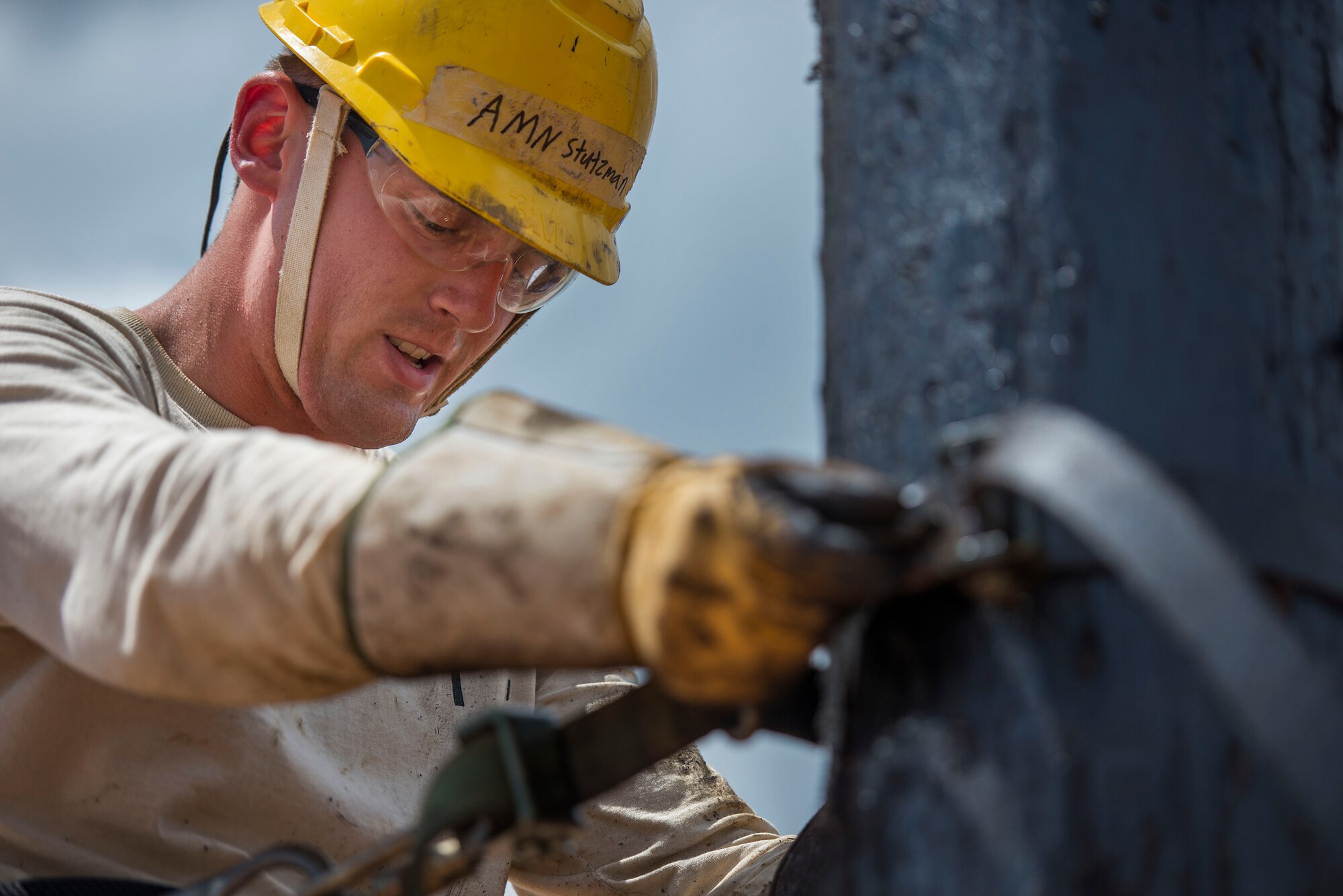 U.S. Air Force Airman Zachary Stutzman, 366th Training Squadron student, secures his climbing straps as part of his training at Sheppard Air Force Base, Texas, May 18, 2015. Sheppard produced more than 60,000 graduates in 2014 from nearly 1,000 available courses. (U.S. Air Force photo by Senior Airman Kyle Gese/Released)