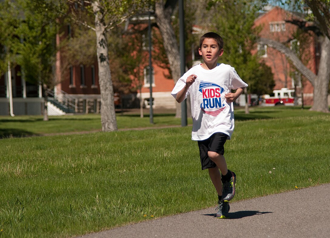 Zachary Taylor, 8, makes his way down the track around the Argonne Parade Field on F.E. Warren Air Force Base, Wyo., during the America’s Kids Run race May 16, 2015. Taylor finished first in the 7 to 9 age group of the race. (U.S. Air Force photo by Senior Airman Jason Wiese)