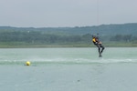 A rescue swimmer is lowered to the water during a helicopter search and rescue training event May 7, 2015, at Canyon Lake, Texas. Members of the 39th Flying Training Squadron, along with the Texas Army National Guard, Texas Task Force 1 and the Texas Parks and Wildlife Department trained together to remain proficient water rescue and survival techniques. (U.S. Air Force photo by Airman 1st Class Stormy Archer/Released)