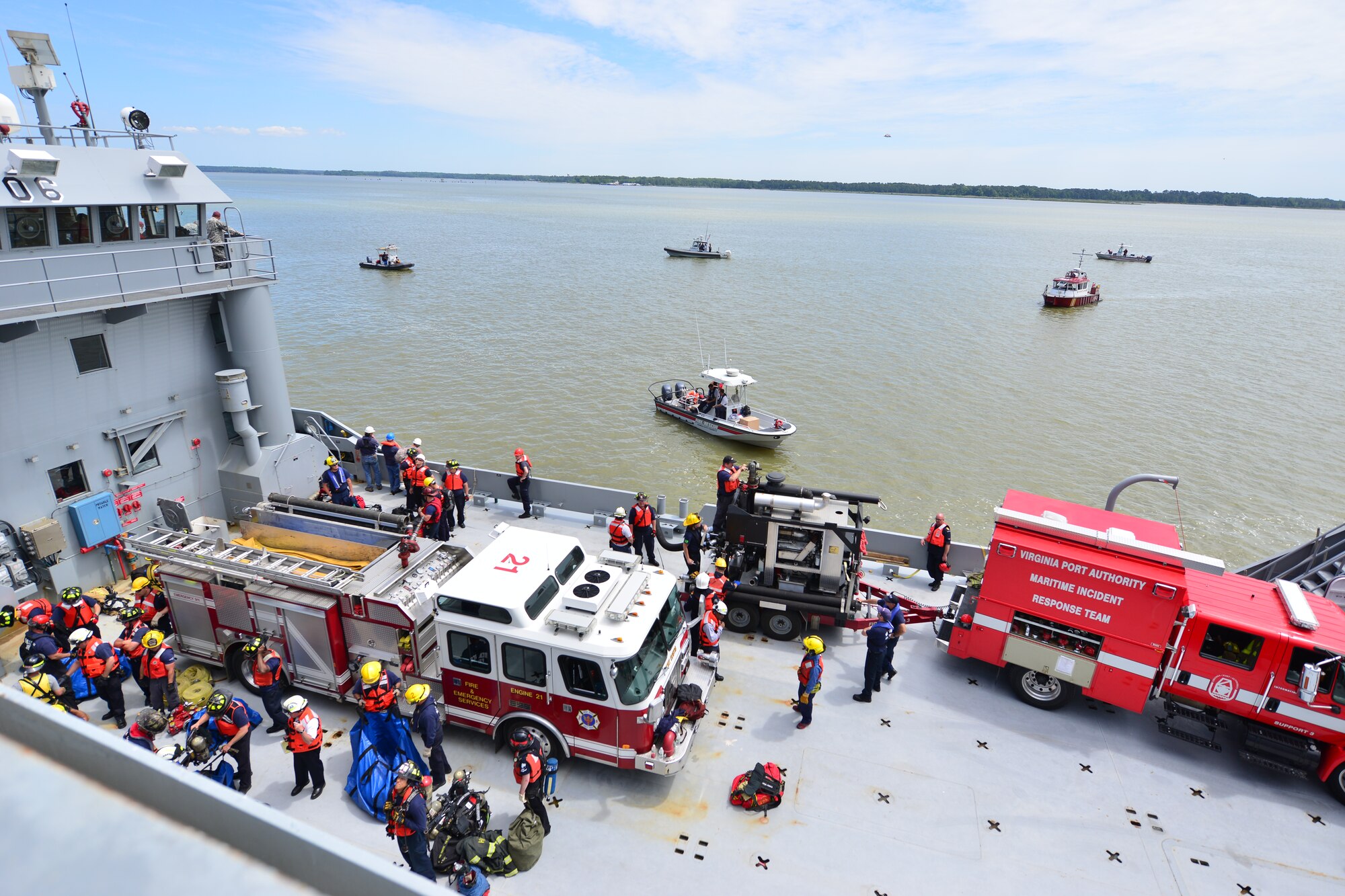 Students of the Hampton Roads Marine Firefighting School prepare to participate in the maritime incident response exercise at Fort Eustis, Va., May 15, 2015. This is the 24th year this event took place giving opportunity to firefighters who have little to no experience with maritime response to learn established incident response and control tactics. (U.S. Air Force photo by Staff Sgt. Natasha Stannard/Released)