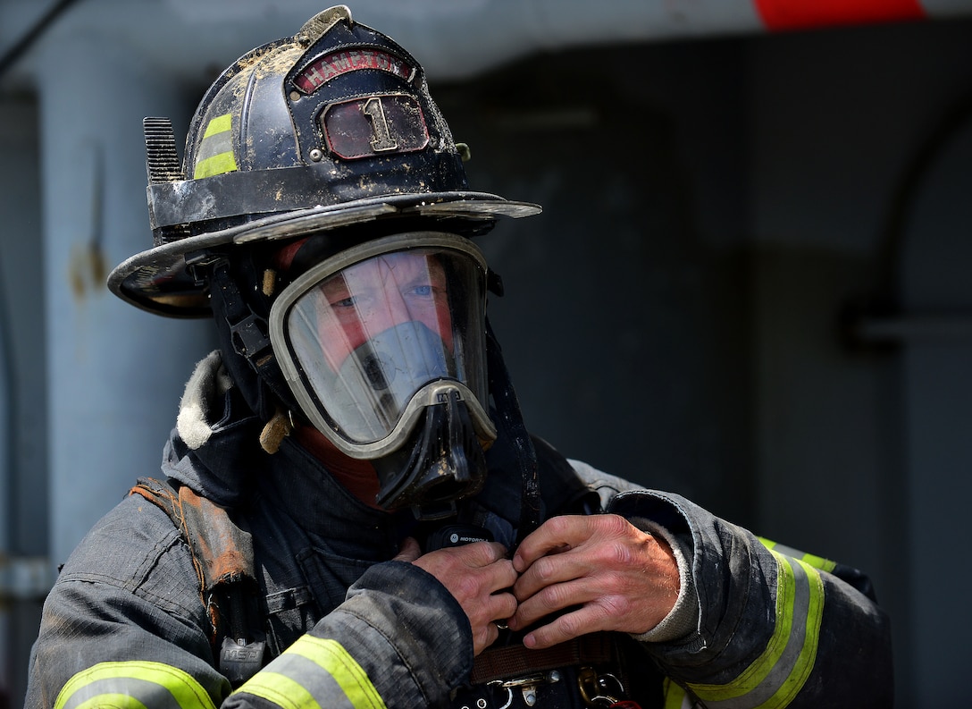 Mike McMullen, City of Hampton firefighter, participates in the 24th Annual Hampton Roads Marine Firefighting School maritime incident response exercise at Fort Eustis, Va., May 15, 2015. McMullen participated in the event along with approximately 150 other U.S. civil firefighters and U.S. and foreign military firefighters. The school not only prepares firefighters for maritime incident response, but is a way to exchange tactics and ideas to better respond to such incidents.  (U.S. Air Force photo by Staff Sgt. Natasha Stannard/Released)