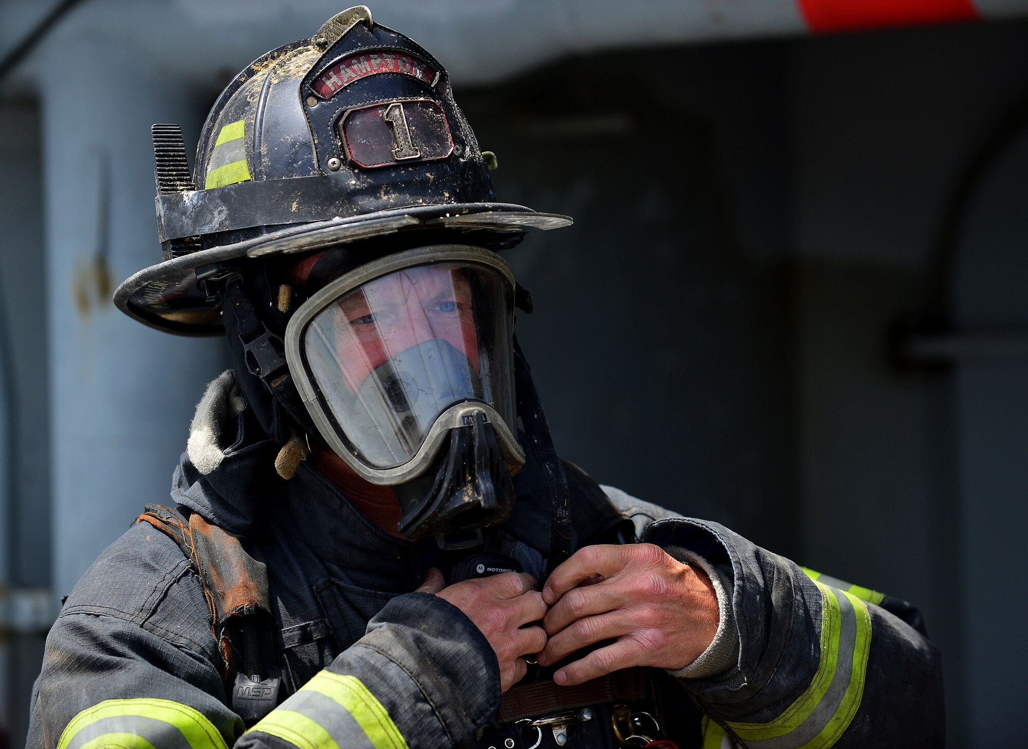 Mike McMullen, City of Hampton firefighter, participates in the 24th Annual Hampton Roads Marine Firefighting School maritime incident response exercise at Fort Eustis, Va., May 15, 2015. McMullen participated in the event along with approximately 150 other U.S. civil firefighters and U.S. and foreign military firefighters. The school not only prepares firefighters for maritime incident response, but is a way to exchange tactics and ideas to better respond to such incidents.  (U.S. Air Force photo by Staff Sgt. Natasha Stannard/Released)