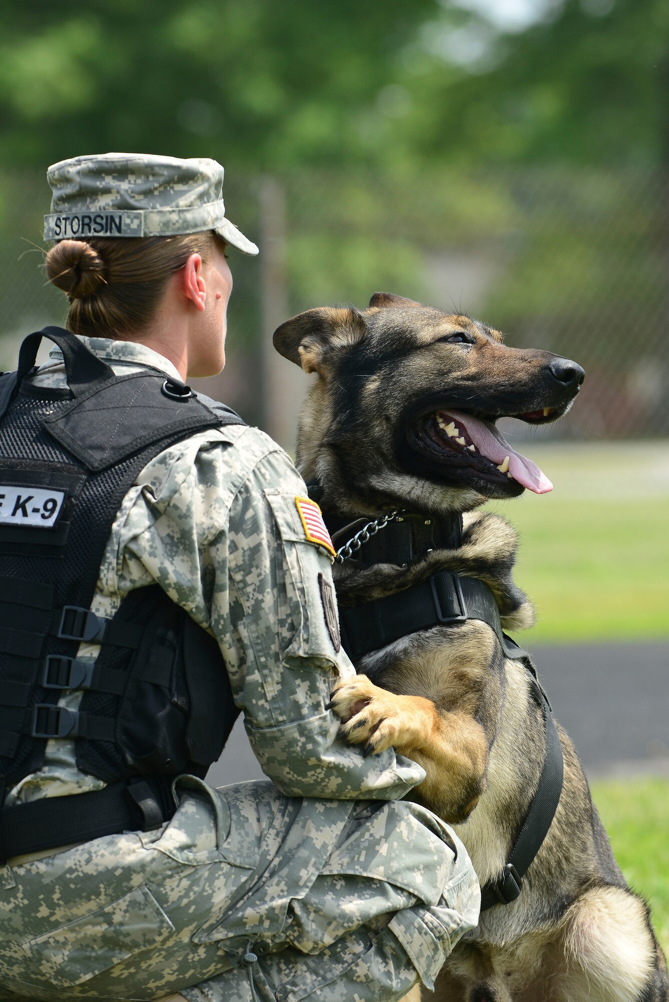 U.S. Army Sgt. Melinda Storsin, 3rd Military Police Detachment military working dog handler, and Sarik, Fort Eustis MWD, waits for instructions during a demonstration at the 50th Vietnam War Commemoration at Fort Eustis, Va., May 16, 2015. Sarik is 4 years old and has been with Storsin, for several years. (U.S. Air Force photo by Senior Airman Kimberly Nagle/Released)  