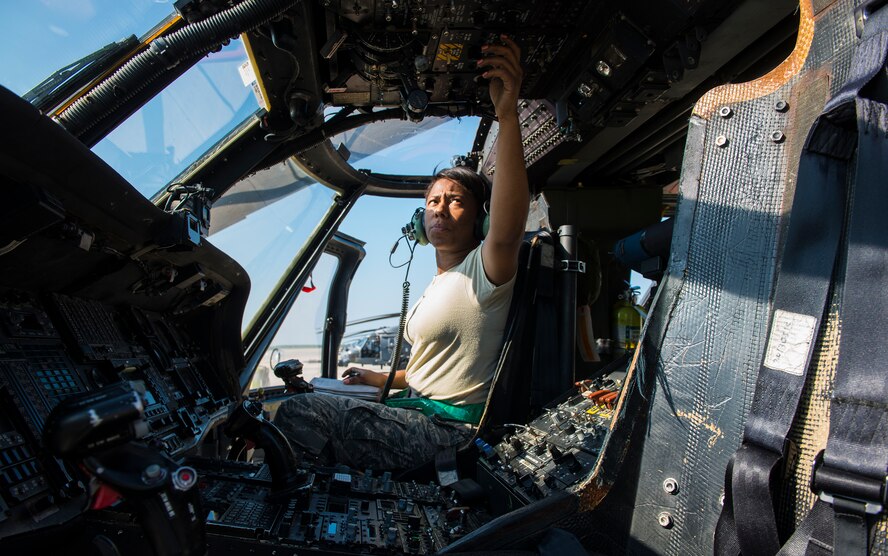 U.S. Air Force Staff Sgt. Tameka Lindsay, 41st Helicopter Maintenance Unit load crew chief, switches on the power in an HH-60G Pave Hawk during the 23d Wing weapons load competition May 18, 2015, at Moody Air Force Base, Ga. The 23d WG began hosting the quarterly competition last year. (U.S. Air Force photo by Airman 1st Class Ceaira Tinsley/Released)