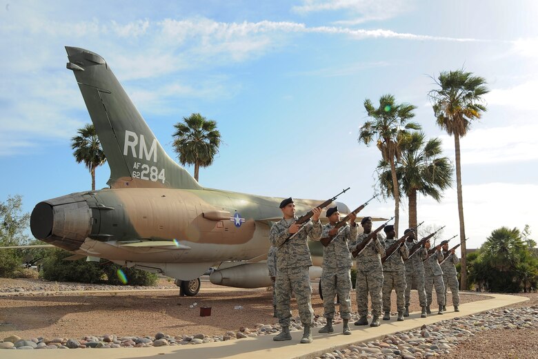 Airmen from the 355th Security Forces Squadron perform a 3-volley rifle salute during a retreat ceremony for National Police Week at Davis-Monthan Air Force Base, Ariz., May 14, 2015. The 3-volley rifle salute was performed for the fallen Air Force security forces Airmen and fallen law enforcement. (U.S. Air Force photo by Staff Sgt. Angela Ruiz/released)