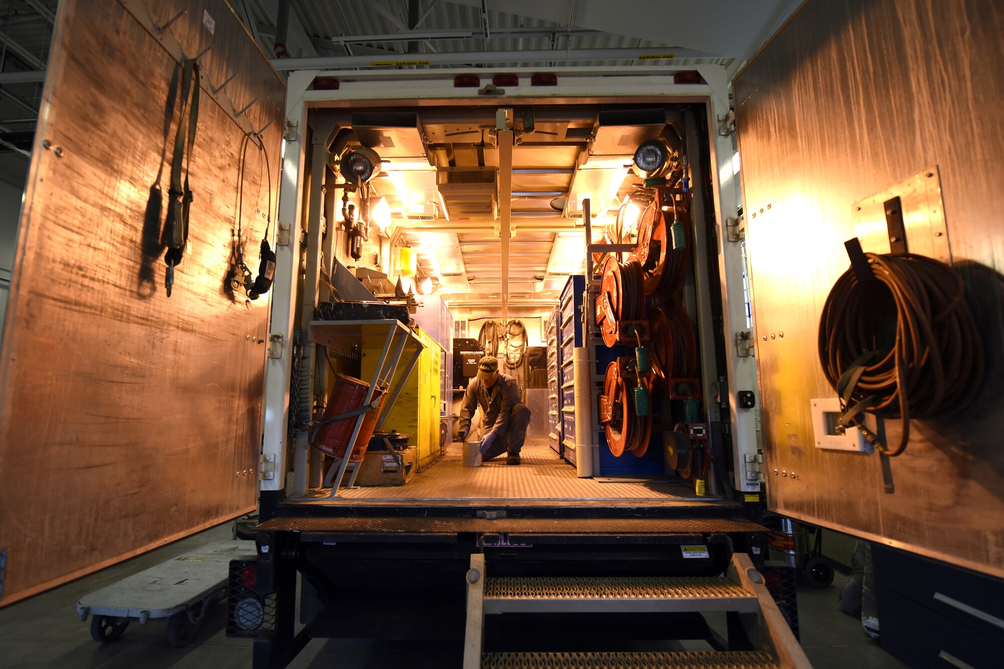 Bob Hassell, 341st Missile Maintenance Squadron corrosion shop mechanic, restocks supplies in the back of an maintenance van mobile work shop to prepare for a dispatch to the field May 14, 2015, at Malmstrom Air Force Base, Mont. The technicians conduct periodic maintenance inspections and perform corrosion control work to sustain launch and missile alert facilities. (U.S. Air Force photo/Chris Willis)