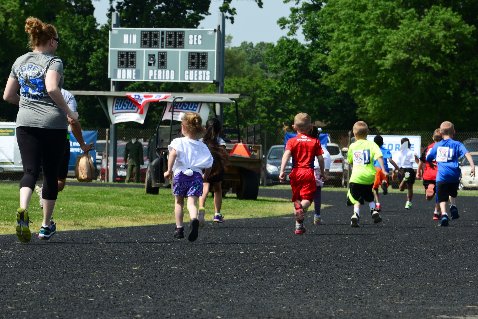 Children and parents take part in the kid’s race during the 50th Vietnam War Commemoration events at Fort Eustis, Va., May 16, 5015. There were multiple races for children, which were broken down by distance and age groups.  (U.S. Air Force photo by Senior Airman Kimberly Nagle/Released)  