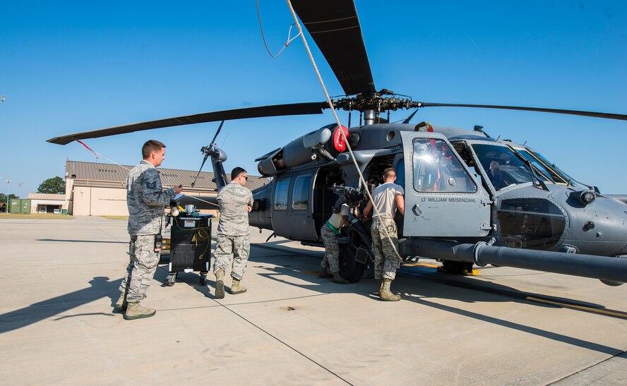 Airmen from the 41st Helicopter Maintenance Unit compete in the 23d Wing weapons load competition May 18, 2015, at Moody Air Force Base, Ga. The squadrons competing were the 41st HMU, and the 823d and 923d Aircraft Maintenance Squadrons stationed out of Davis-Monthan AFB, Ariz., and Nellis AFB, Nev. (U.S. Air Force photo by Airman 1st Class Ceaira Tinsley/Released)