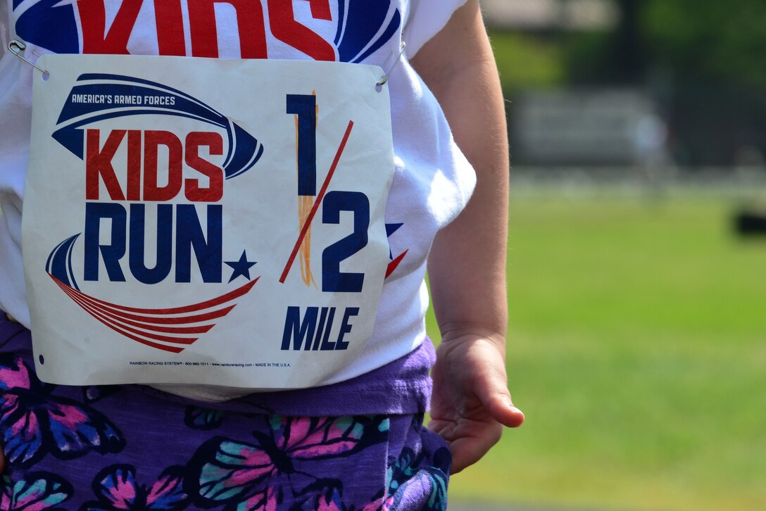 A child waits their turn for the kids run at the 50th Vietnam War Commemoration at Fort Eustis, Va., May 16, 2015. Children raced around the track at Murphy Field while spectators viewed various booths and participated in additional events at the inside of the track. (U.S. Air Force photo by Senior Airman Kimberly Nagle/Released)  
