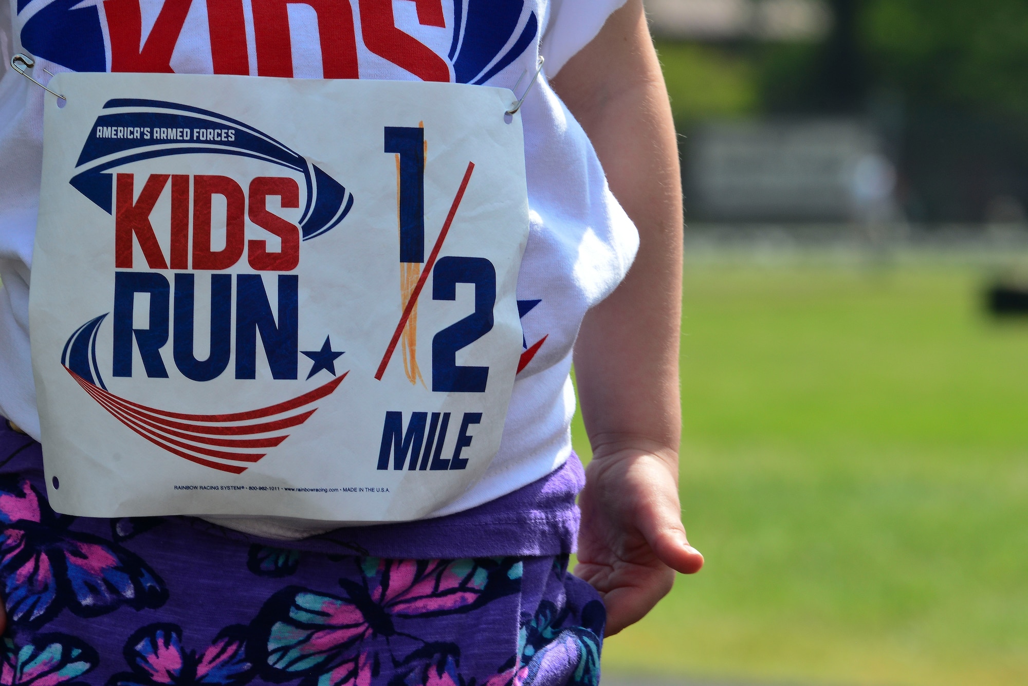 A child waits their turn for the kids run at the 50th Vietnam War Commemoration at Fort Eustis, Va., May 16, 2015. Children raced around the track at Murphy Field while spectators viewed various booths and participated in additional events at the inside of the track. (U.S. Air Force photo by Senior Airman Kimberly Nagle/Released)  