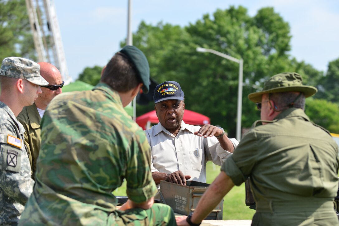 Vietnam Veteran U.S. Army Chief Warrant Officer 3 (retired) John Gragg speaks with Joint Base Langley-Eustis Vietnam Commemoration participants at Fort Eustis, Va., May 16, 2015. Gragg spoke about his time serving two tours in Vietnam as an Army boat captain. (U.S. Air Force photo by Staff Sgt. Natasha Stannard/Released)