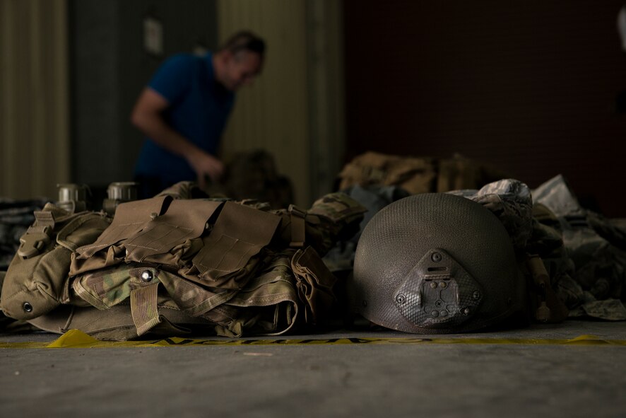 U.S. Air Force Senior Airman Zacheriah Day, 11th Air Support Operations Squadron records management journeyman unpacks his bag for a contents inspection during Spartan Warrior May 11, 2015, at Avon Park Air Force Range, Fla. Inspectors from the 93d Air Ground Operations Wing checked each competitor upon arrival to ensure they were traveling with all required items. (U.S. Air Force photo by Senior Airman Ryan Callaghan/Released)

