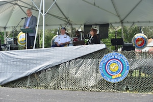 Vietnam Veteran U.S. Air Force Col. (retired) Douglas Webster, left, speaks at the Joint Base Langley-Eustis Vietnam Commemoration opening ceremony at Fort Eustis, Va., May 16, 2015. Webster was a C-130 navigator who survived an engine malfunctioning while in flight during the Vietnam conflict. (U.S. Air Force photo by Staff Sgt. Natasha Stannard/Released) 