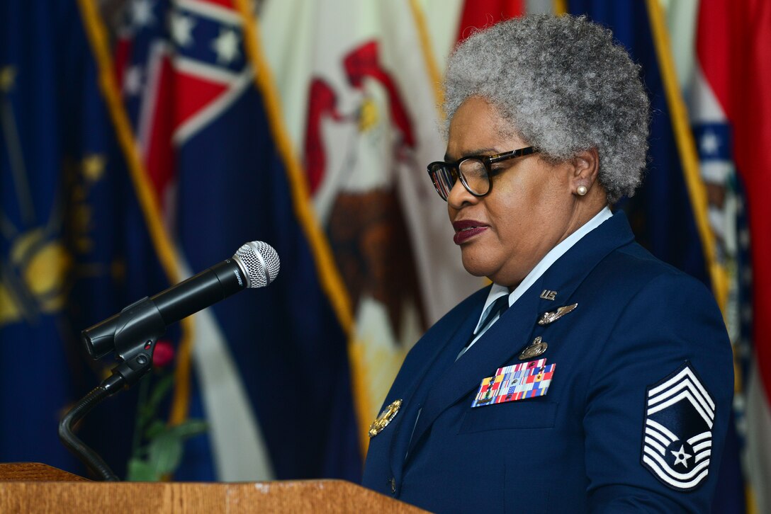 U.S. Air Force Retired Chief Master Sgt. Deborah Rothwell, performs her rendition of “Old Glory” during the 50th Vietnam War Commemoration luncheon at Fort Eustis, Va., May 15, 2015. Rothwell performed her rendition as a spoken word, with music in the background. (U.S. Air Force photo by Senior Airman Kimberly Nagle/Released)  