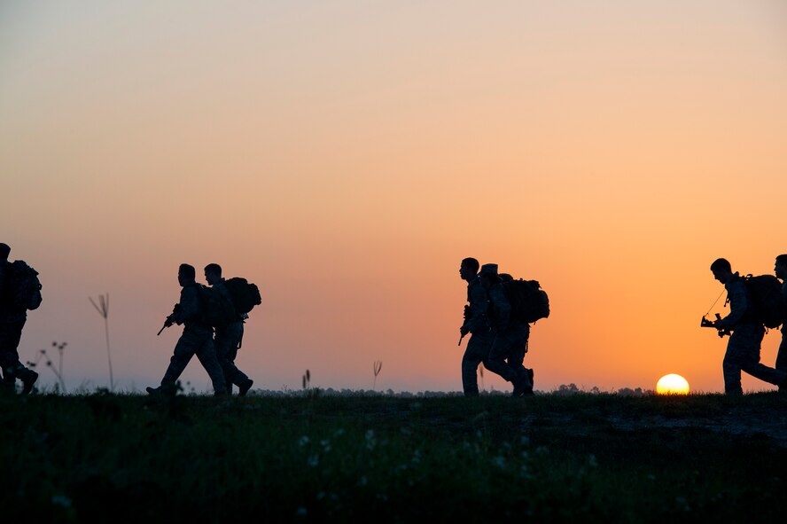 Airmen from the 93d Air Ground Operations Wing run the final stretch of a four-mile ruck march during Spartan Warrior May 12, 2015, at Avon Park Air Force Range, Fla. Spartan Warrior is an annual wing combat readiness inspection and competition held by the 93d AGOW. (U.S. Air Force photo by Senior Airman Ryan Callaghan/Released)