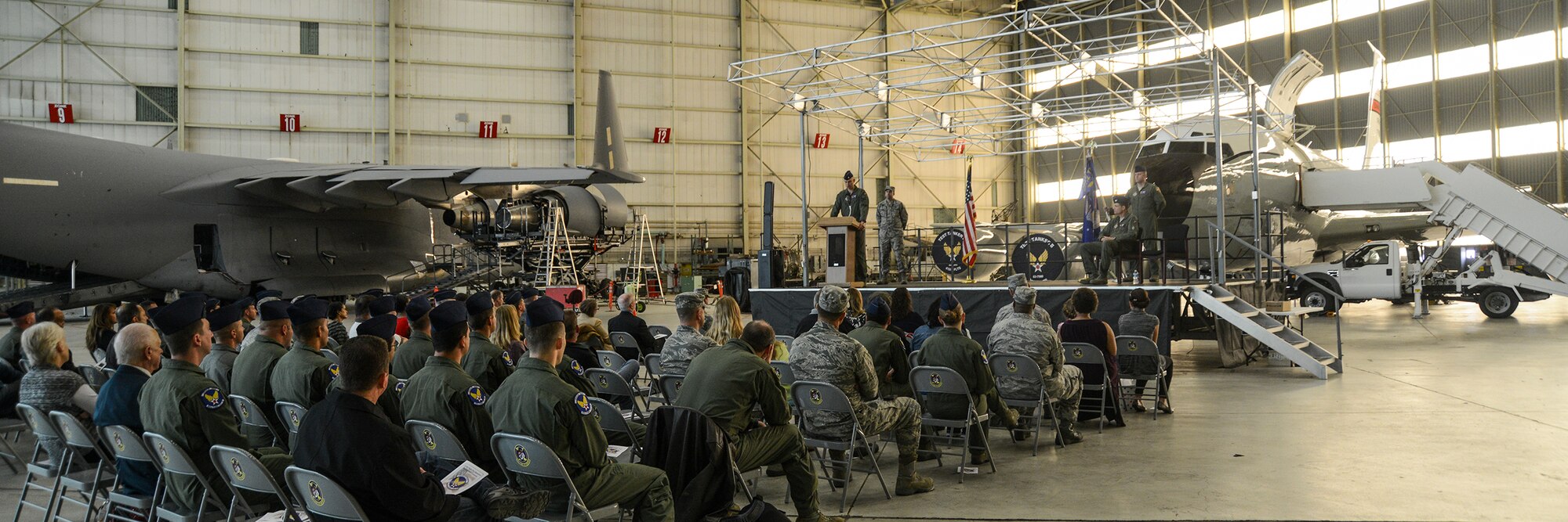 After Senior Master Sgt. Tony Fretta, furled the 412th Flight Test Squadron guidon, Lt. Col. Michael Davis, 412th FLTS commander, and Col. Rodney Todaro, 412th Operations Group commander, prepared it to be sent to Maxwell Air Force Base, Alabama where the Air Force Historical Research Agency will take ownership of the unit flag. (U.S. Air Force photo by Rebecca Amber)