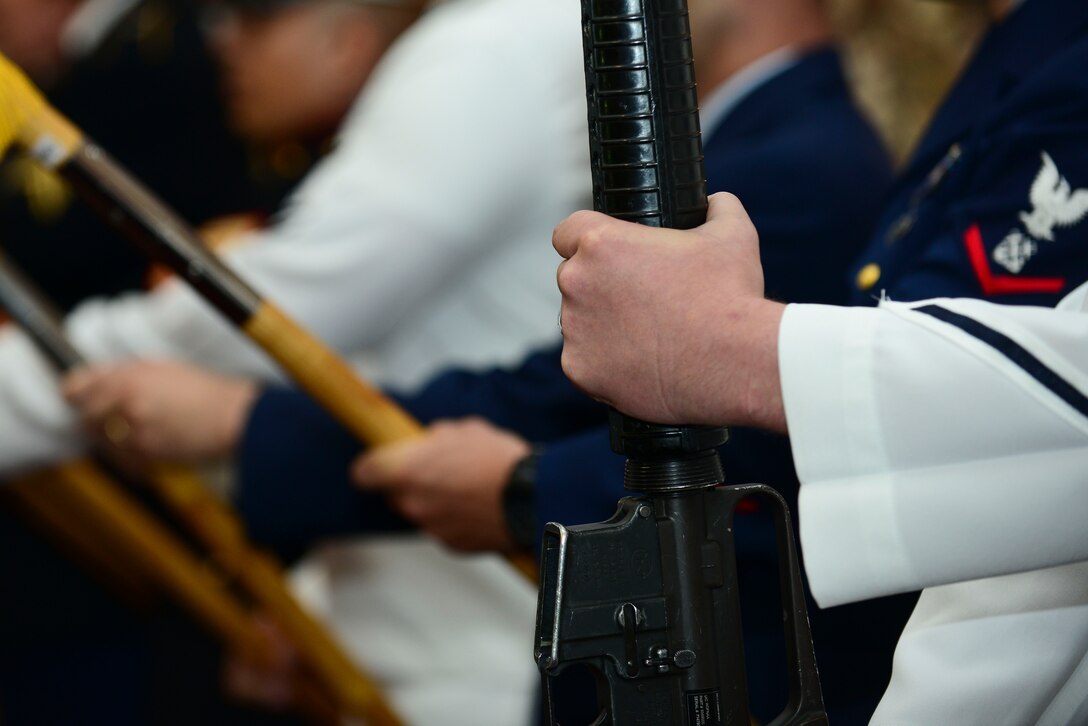Members of a joint color guard, present the colors before the 50th Vietnam War Commemoration luncheon at Fort Eustis, Va., May 15, 2015. The color guard also conducted a flag folding ceremony during the event. (U.S. Air Force photo by Senior Airman Kimberly Nagle/Released)  