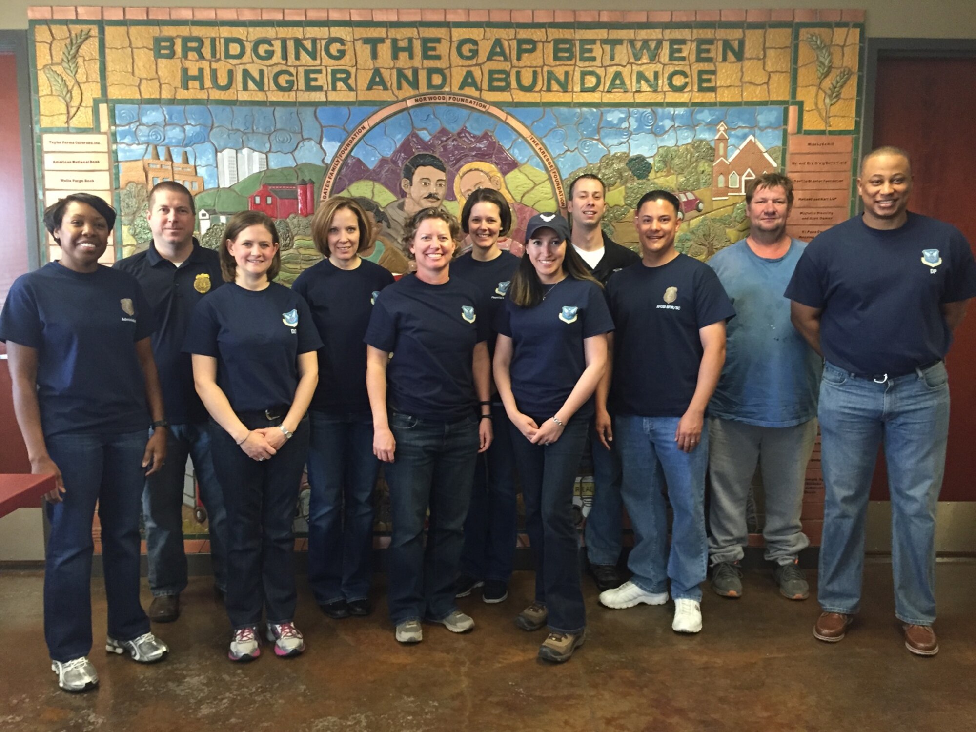 AFOSI’s Region 8 personnel volunteered, May 15, 2015, at a food bank in Colorado Springs, Colo., as part of the U.S. Postal Service Care and Share food drive. Region 8 members sorted food that was recently collected.