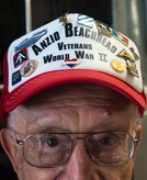 John Boller, shows off his World War II pins, May 15, 2015 at Joint Base Charleston, S.C. during a tour of the installation. Twenty three Anzio veterans were in Charleston to celebrate what could be their last reunion event together and to share their stories with the servicemembers stationed here. Boller who is 90-years-old was a member of the 3rd Infantry Division. The invasion of Anzio, near the outskirts of Rome, began Jan. 22, 1944, lasted four months and took the lives of nearly 2,800 Americans . (U.S. Air Force photo/Senior Airman Jared Trimarchi) 