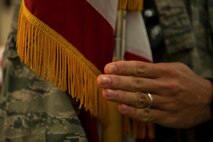 An Airman in the Honor Guard training program holds the flag steadily as he goes through a training drill at Minot Air Force Base, N.D., May 14, 2015. Honor Guard is an opportunity for Airmen to learn about Air Force heritage and tradition. (U.S. Air Force photo/Airman 1st Class Christian Sullivan)