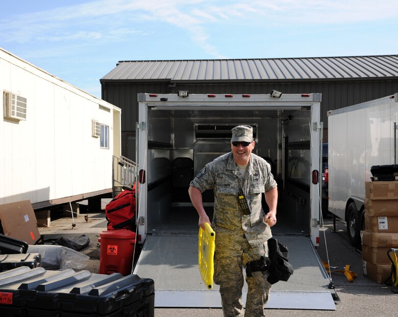 Master Sgt. Dan Marx, NCO-in-charge, 113th Wing's Fatality Search and Recovery Team, unloads a trailer during Chemical Biological Radiological Nuclear (CBRN) Emergency Response Force Package training, May 14, 2015 in Virginia Beach, Va.  (U.S. Air National Guard photo by Airman 1st Class Anthony Small)