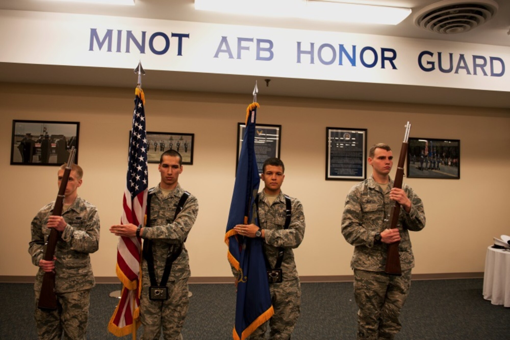 Airmen stand at attention while practicing Honor Guard routines at Minot Air Force Base, N.D., May, 14, 2015. Performing in the Honor Guard is an opportunity for Airmen to learn about Air Force heritage and tradition. (U.S. Air Force photo/Airman 1st Class Christian Sullivan)