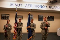 Airmen stand at attention while practicing Honor Guard routines at Minot Air Force Base, N.D., May, 14, 2015. Performing in the Honor Guard is an opportunity for Airmen to learn about Air Force heritage and tradition. (U.S. Air Force photo/Airman 1st Class Christian Sullivan)