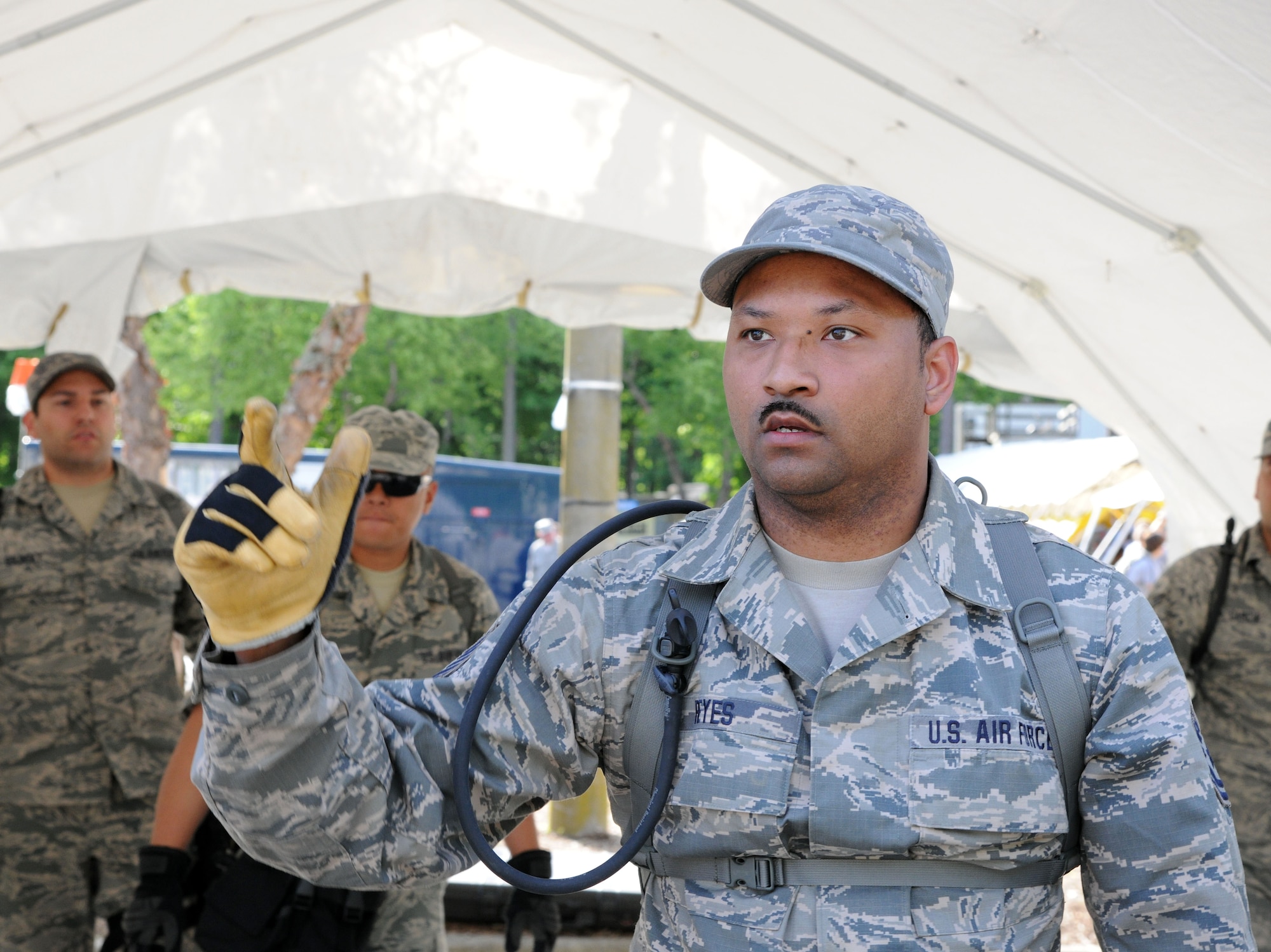 Tech. Sgt. Chito Reyes, 113th services flight, D.C. Air National Guard, briefs Bravo Team members during  Chemical Biological Radiological Nuclear (CBRN) Emergency Response Force Package training, May 14, 2015 in Virginia Beach, Va.  (U.S. Air National Guard photo by Airman 1st Class Anthony Small)