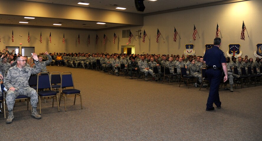 Louisiana State Trooper Matt Harris, Troop G, speaks to Airmen of the 2nd Bomb Wing during a Wing Safety Day briefing on Barksdale Air Force Base, Louisiana, May 15, 2015. Harris spoke about how many lives are lost each year due to impaired driving and texting and driving. (U.S. Air Force photo/Senior Airman Joseph A. Pagán Jr.)