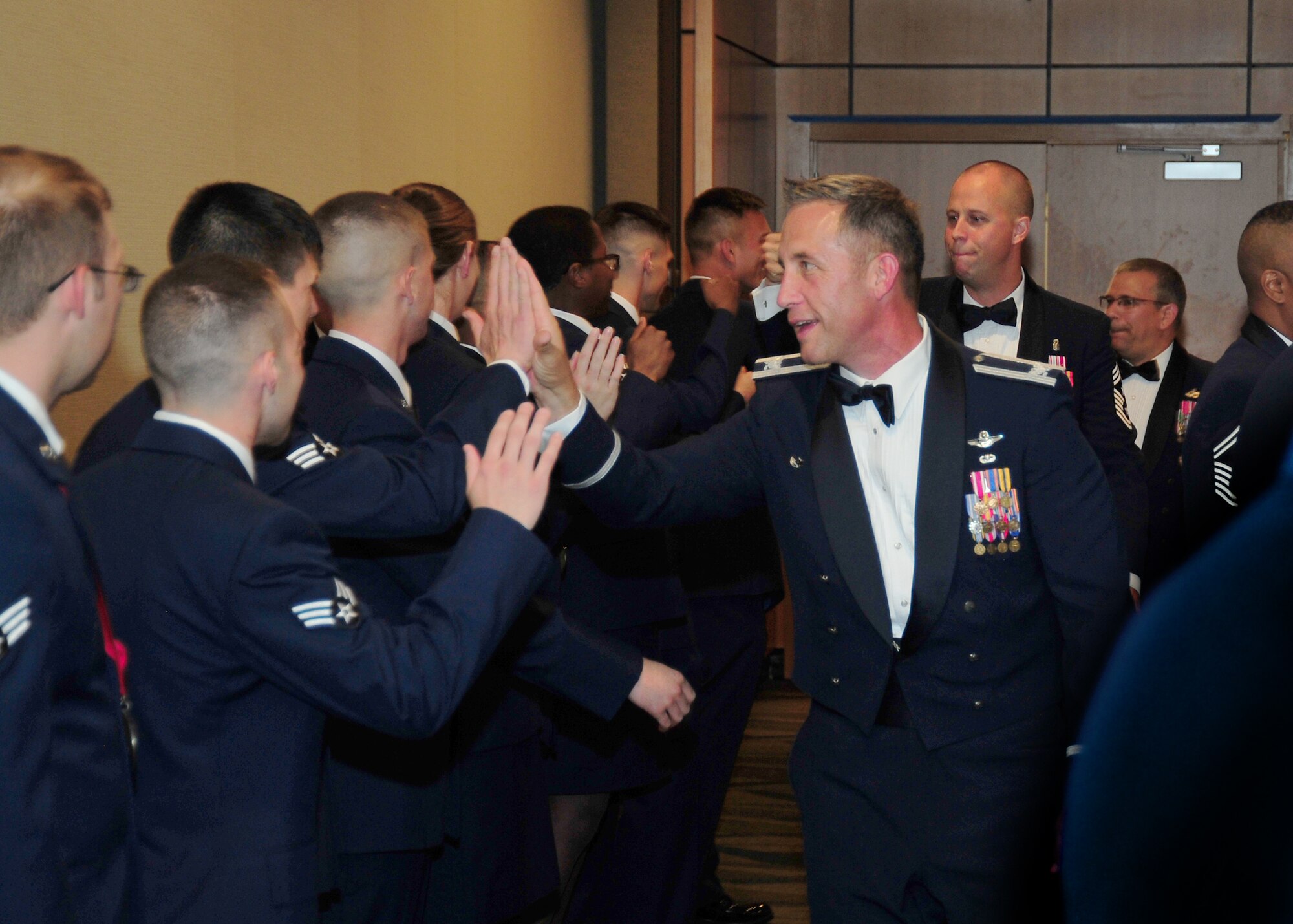 Members of Team Tyndall congratulate Airman Leadership School class 15-4 after their graduation ceremony May 14 at the Horizons Community Center. ALS is a five week-long Air Force program designed to develop Airmen into effective front-line supervisors. (U.S. Air Force photo by Airman 1st Class Dustin Mullen)