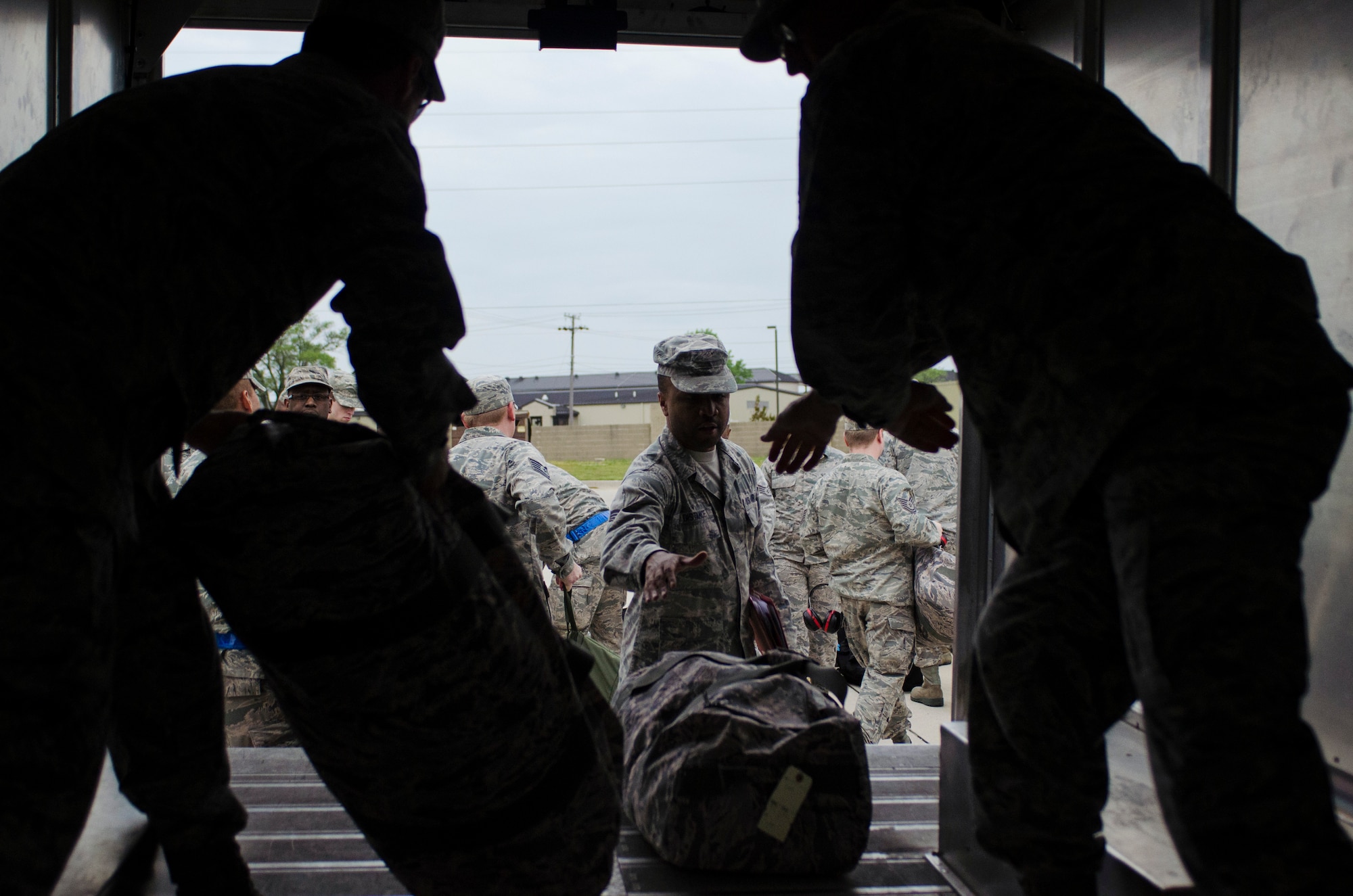 Members from the 512th Airlift Wing sign out for receiving deployment gear prior to their simulated deployment exercise May 17 at Dover Air Force Base, Del. Liberty Wing reservists are taking part of the year's first deployment exercise to rehearse a large, mass deployment situation. More than 60 Reservists simulated a large, mass deployment situation, including deployment briefings and  a "bag drag" of all their combat equipment. (U.S. Air Force photo/ Capt. Bernie Kale)